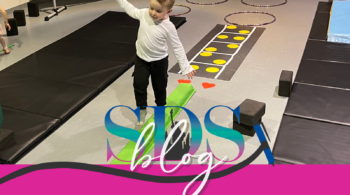 Blog post showing boy taking tiny tumblers class by walking on a beam